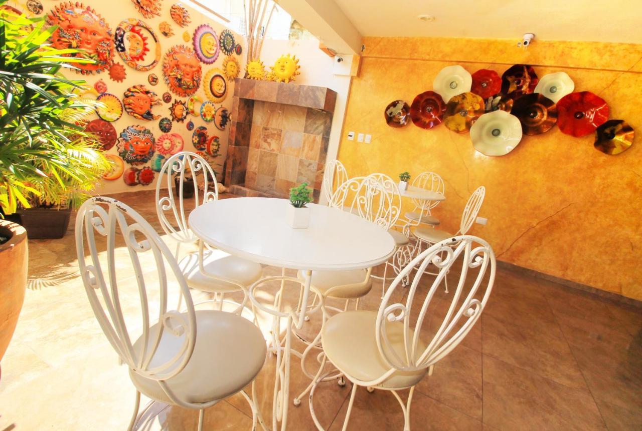 Papagayo Hotel Boutique ปลายาเดลการ์เมน ภายนอก รูปภาพ A typical interior of a coffee shop in the city